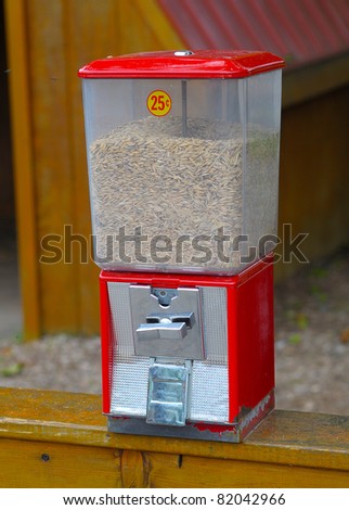 Red Grain dispenser for hand feeding petting zoo animals