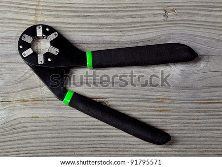 New black and green all purpose wrench. (socket wrench)