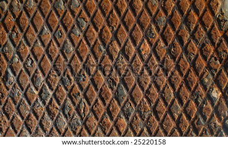 rusted metal grid plate with flakes peeling off - lots of texture