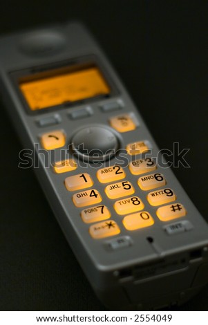Closeup view of a cordless phone with illuminated keypad (shallow DOF)