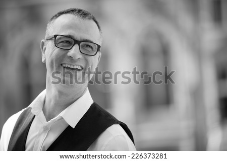 Candid shot of Waiter in Grand Place, Mons, Belgium black and white