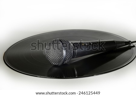 Microphone placed on a vinyl record album