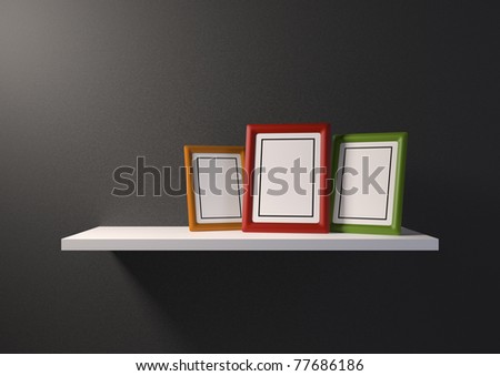 Bookshelf with an empty green photo frame