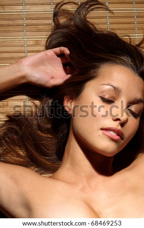 Beauty Portrait of young woman with eyes shut.