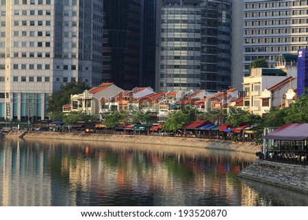 SINGAPORE - May 11: Singapore River with the skyline of Raffles Place at the morning on May 11, 2014 in Singapore. Singapore River is a river near Central Area in the southern part of Singapore