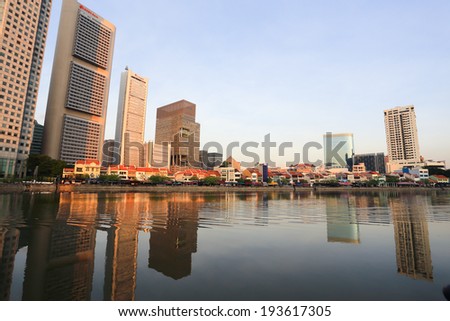 SINGAPORE - May 11: Singapore River with the skyline of Raffles Place at the morning on May 11, 2014 in Singapore. Singapore River is a river near Central Area in the southern part of Singapore