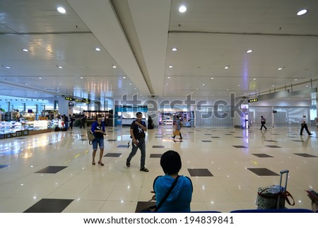 YANGON, MYANMAR - April 8,2014: Traveler walk in passenger terminal at Yangon international airport, that is the biggest airport of Myanmar.