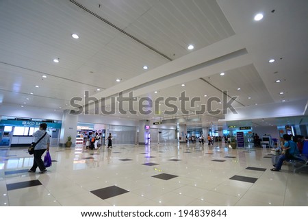 YANGON, MYANMAR - April 8,2014: Traveler walk in passenger terminal at Yangon international airport, that is the biggest airport of Myanmar.