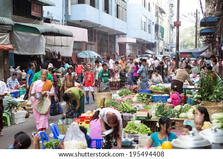 Yangon,Myanmar-April 6, 2014:Trading activities at the downtown Yangon market. This is a local market in the village of Yangon where people come from all over the area to sell fruits,vegetables, etc.