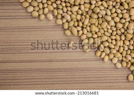 Dry soybeans on wooden board