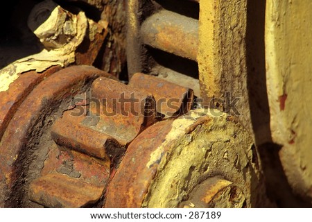 rusty rust gear teeth grind old machine machinery scrap iron metal antique yellow orange