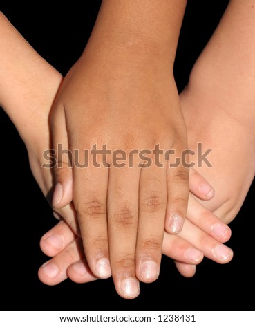 children\'s hands stacked together