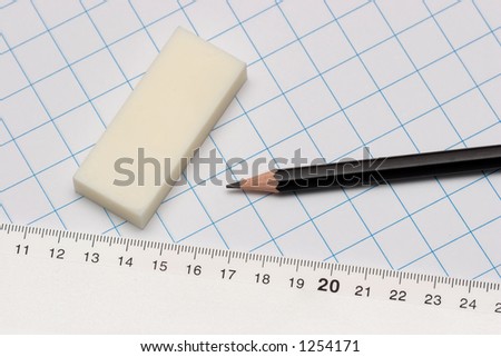 pencil, eraser, ruler, and grid paper