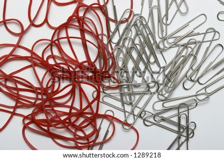stock-photo-red-rubber-bands-and-paper-clips-1289218.jpg