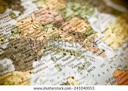 close-up macro photograph of map  Italy . Selective focus on Italy