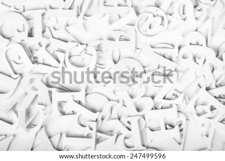 White Latin Letters on a white background.  High key image