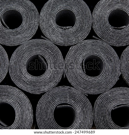 Rolls of new black roof coating or bitumen