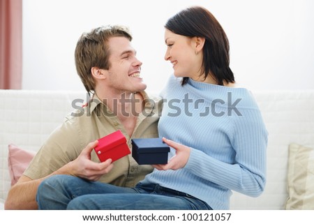 Romantic couple exchanging presents