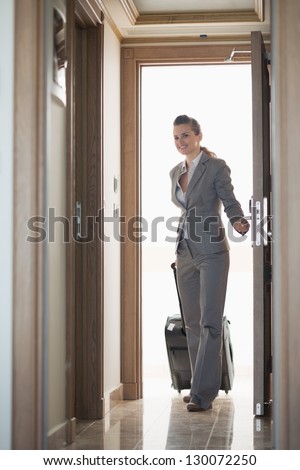 Business woman entering hotel room