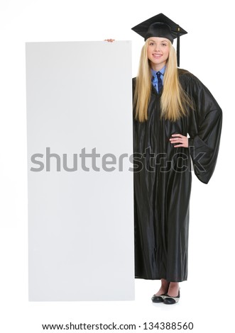 Full Length Portrait Of Smiling Young Woman In Graduation Gown ...