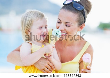 Smiling Baby Giving Mother Ice Cream