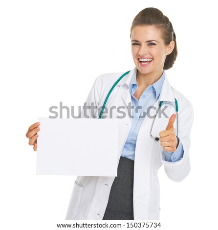 Happy doctor woman showing blank paper sheet and thumbs up