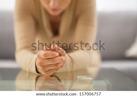 Closeup on hands of stressed young housewife