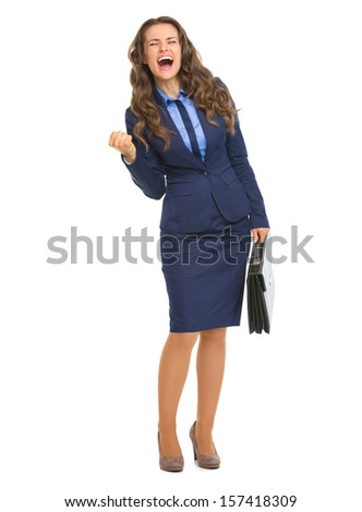 Full length portrait of happy business woman with briefcase making fist pump gesture