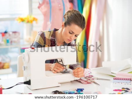 Seamstress working with sewing machine