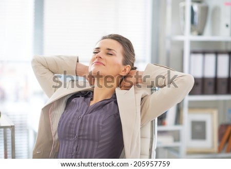 Relaxed business woman in office