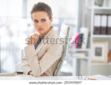 Portrait of concerned business woman in office