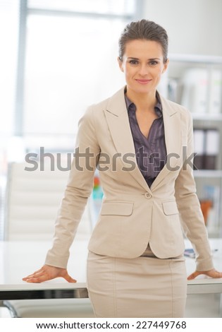 Portrait of business woman standing in office