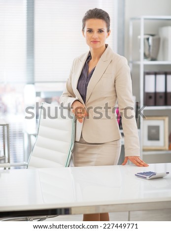 Portrait of business woman standing in office