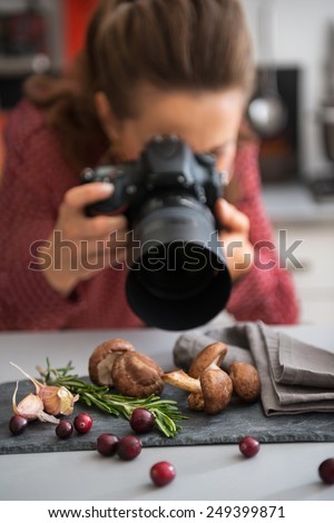 Closeup on female food photographer taking photo