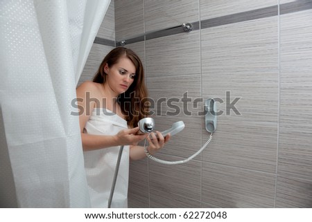 woman behind curtain making a call at bathroom