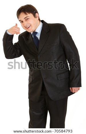 Smiling young businessman showing contact me gesture isolated on white