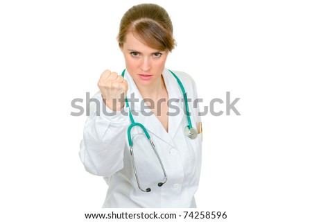 Angry medical doctor woman threaten with fist isolated on white