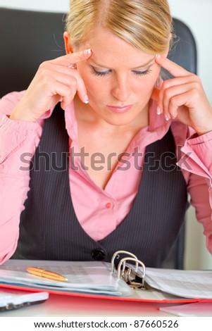 Portrait of hard working on document business woman