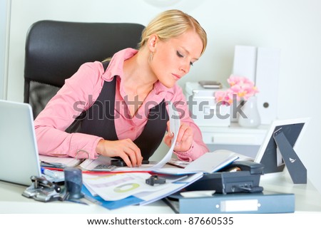 Hard working on documents business woman