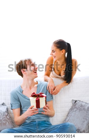 Young girl present gift to her boyfriend