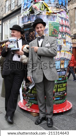EDINBURGH- AUGUST 16: Members of Lucky Dog Theatre Productions publicize their show Hats Off To Laurel and Hardy during Edinburgh Fringe Festival on August 16, 2014 in Edinburgh Scotland