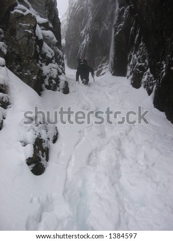 climbing up a snow filled gully in Glencoe