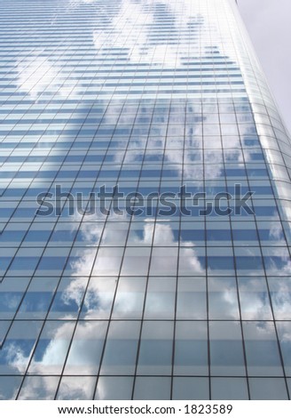 clouds reflected in modern office building