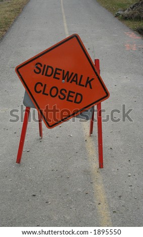 sidewalk closed sign on footpath