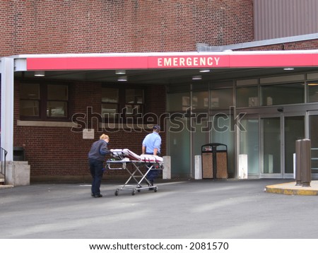 Staff and patient at emergency room entrance