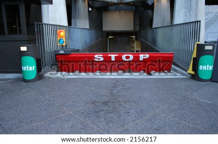 security stop barrier at entrance to office building car park