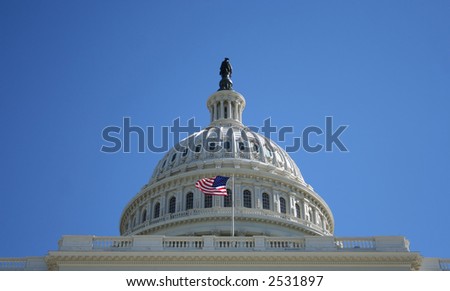 Dome of US Capitol building and American Flag Washington DC