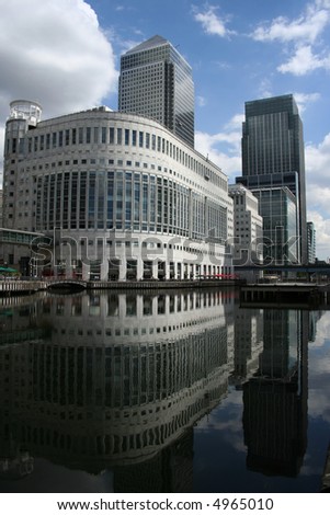 modern skyline of London Docklands reflected in water