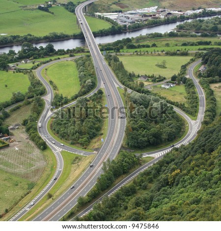 aerial view of road junction beside river
