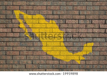yellow Mexico map painted on brick wall